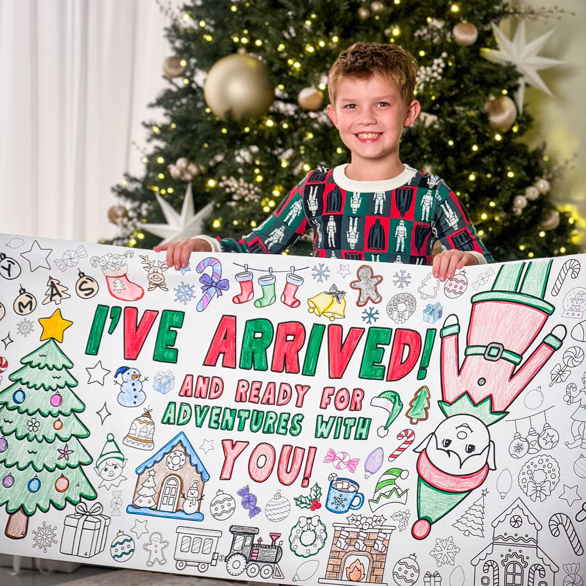 Complement your Elf Kit 2025 with an Elf Arrival Giant Coloring Banner so your elf doesn’t just sit on the shelf. This Elf Arrival Banner is full of magic, christmas themes to make your elf's arrival grand adventure.  Check out our shop for a fun elfin adventures while waiting around for Santa in December! Coloring banner with Christmas-themed elements and text, featuring two children coloring.