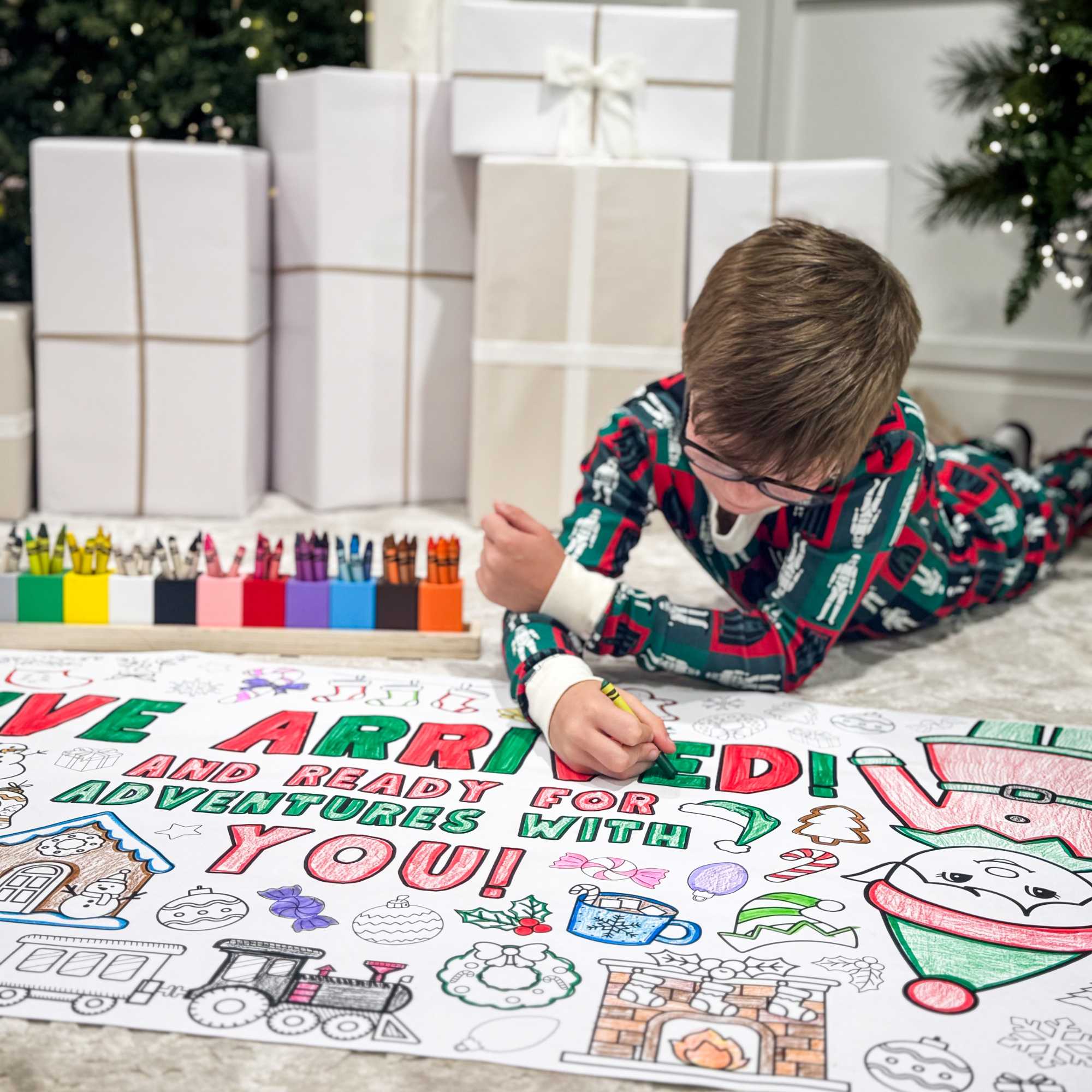 Complement your Elf Kit 2025 with an Elf Arrival Giant Coloring Banner so your elf doesn’t just sit on the shelf. This Elf Arrival Banner is full of magic, christmas themes to make your elf's arrival grand adventure.  Check out our shop for a fun elfin adventures while waiting around for Santa in December! Coloring banner with Christmas-themed elements and text, featuring two children coloring.