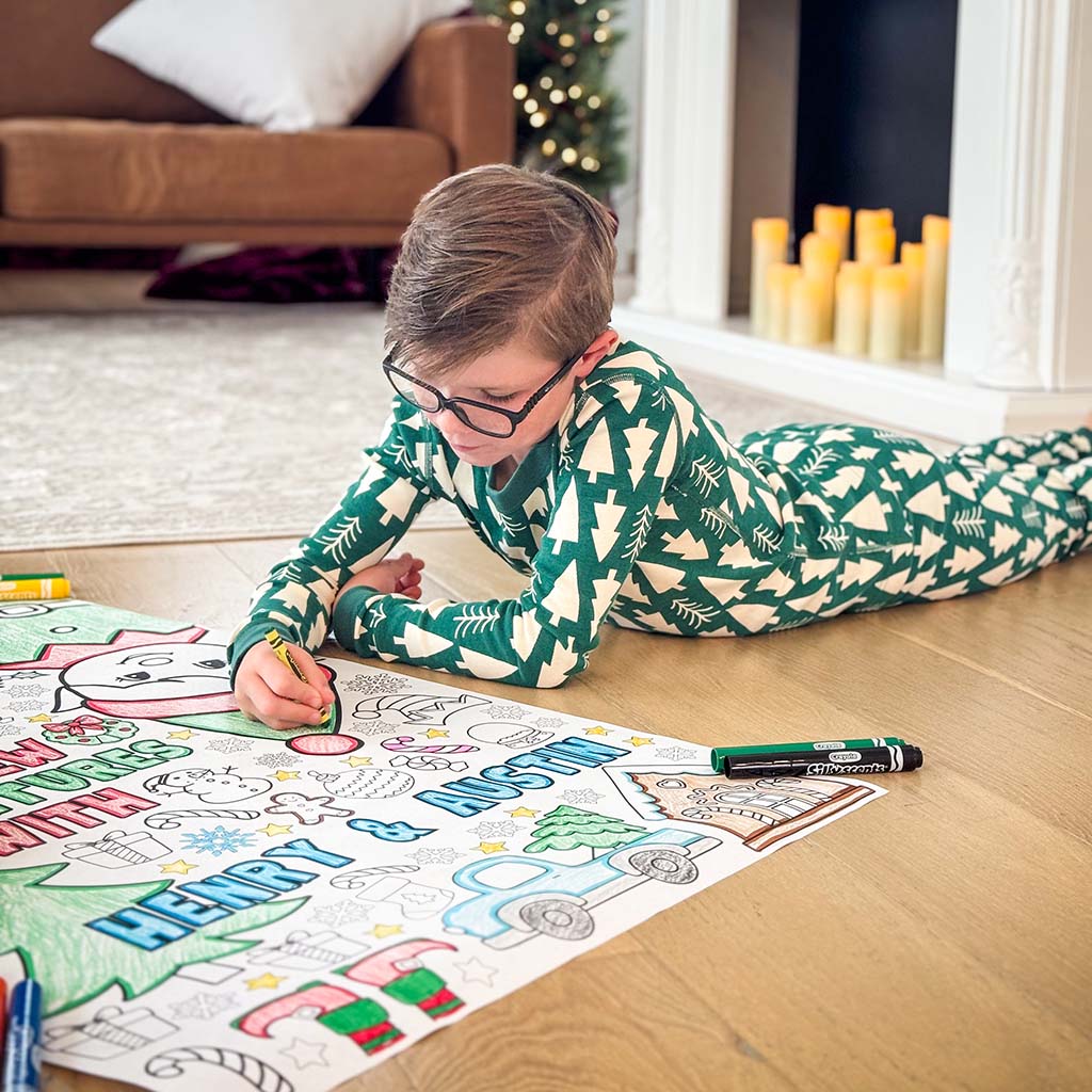elf arrival ideas, elf arrival banner, elf on the shelf, elf on the shelf arrival banner, elf banners, elf welcome back coloring banner, giant coloring sheet, giant coloring banner, big ideas for elf arrival, grand entrance kids activity, welcome back elf arrival banner, elf kit, two children coloring a large sheet of paper on the floor with coloring markers and crayons