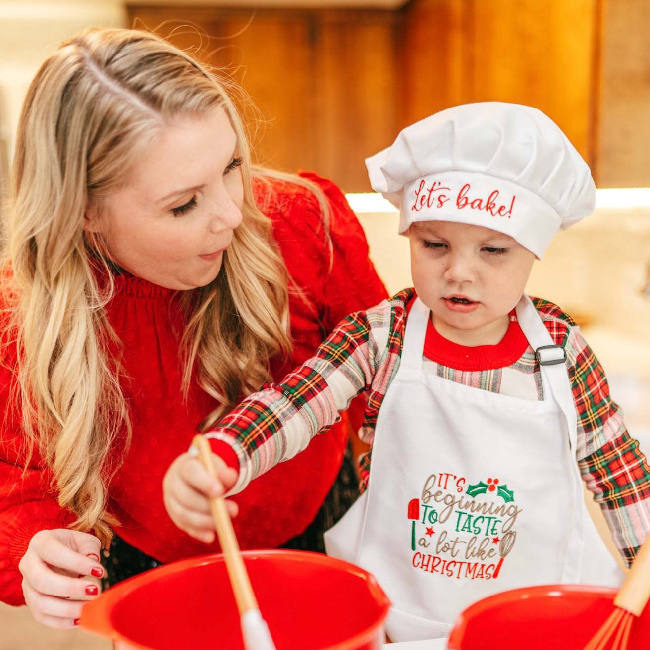 elf prop, baking, kitching, kids apron and chef hat, Woman and child in baking attire preparing food together.
